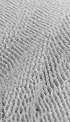 Tiny surface ridges organize smoothly before dissolving naturally into random structures with calming visual rhythm.