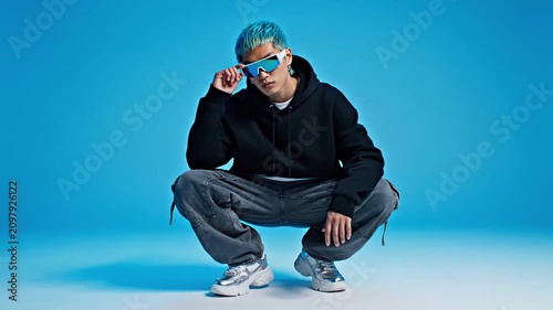 Stylish Young Person Wearing Futuristic Sunglasses in Modern Streetwear Fashion