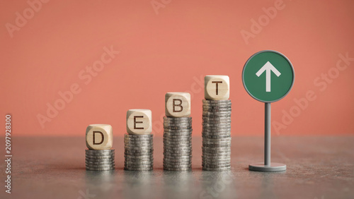 Debt Reduction Concept with Coin Stacks and Upward Recovery Arrow