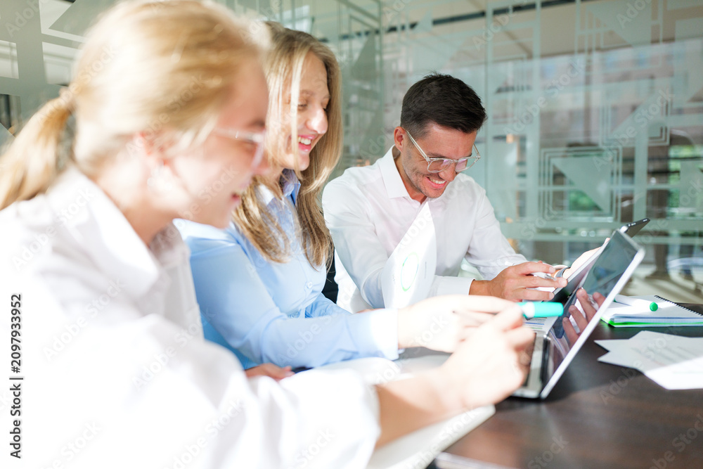 Fototapeta premium Team collaboration shines bright during a creative brainstorming session in a modern office space