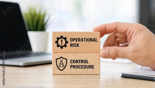 Business risk management concept with wooden blocks on office desk with hand holding block with operational risk and control procedure text for corporate safety strategy