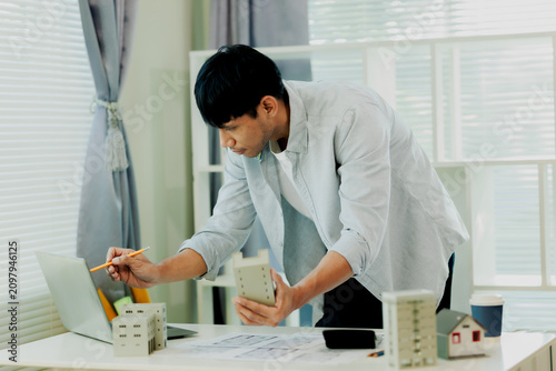 Принти на полотні Engineer calculating building load requirements and materials costs for optimal structural engineering