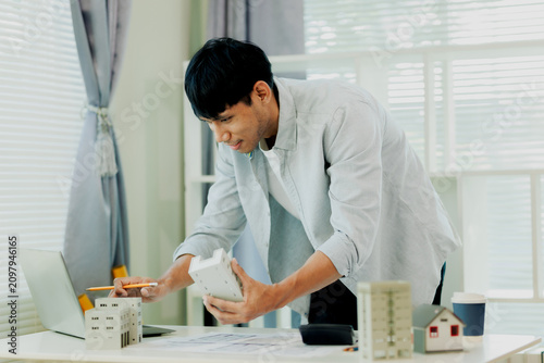 фотографія Engineer calculating building load requirements and materials costs for optimal structural engineering