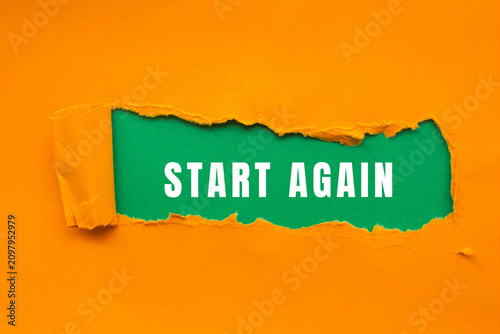 Cuadro en lienzo Torn orange paper revealing the words start again on a vibrant green background,