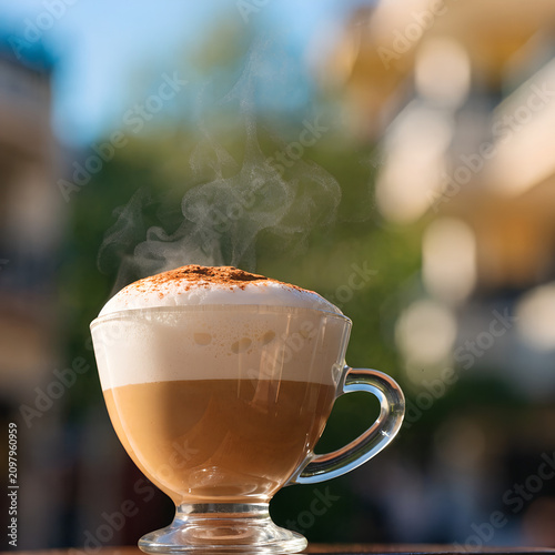 Hot cappuccino coffee, beautifuf background.