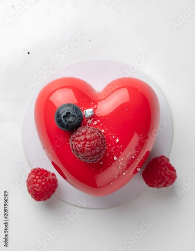 Red heart shaped strawberry dessert close up.