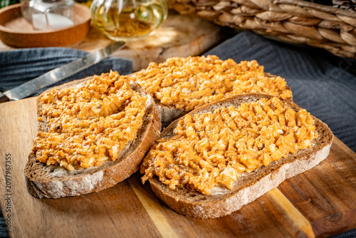 Obraz na płótnie Slices of bread with egg and sprat paste in tomatoes