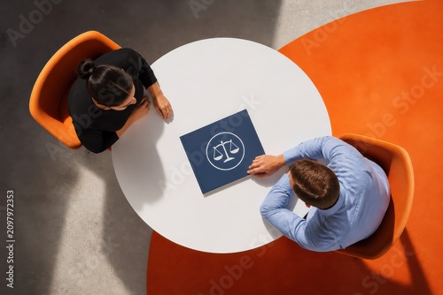 Legal consultation meeting with contract review at office table