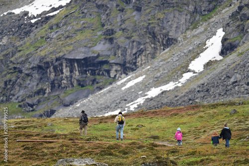 A family of hikers make their way into Alaska's Talkeetna mountains.