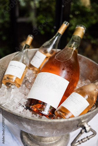 Wine Bottles with Blank Labels in Ice Bucket
Chilled Rose Wine Bottles in Metal Cooler
Elegant Wine Bottle Mockup Served on Ice