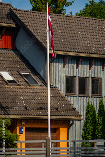 Cuadro en lienzo Latvian flag near residential house