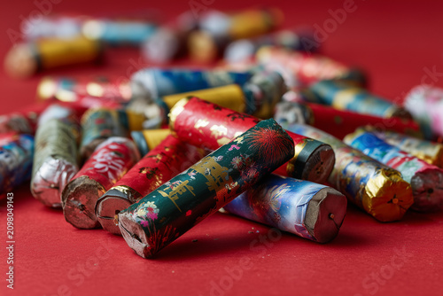Colorful Firecrackers on Red Surface