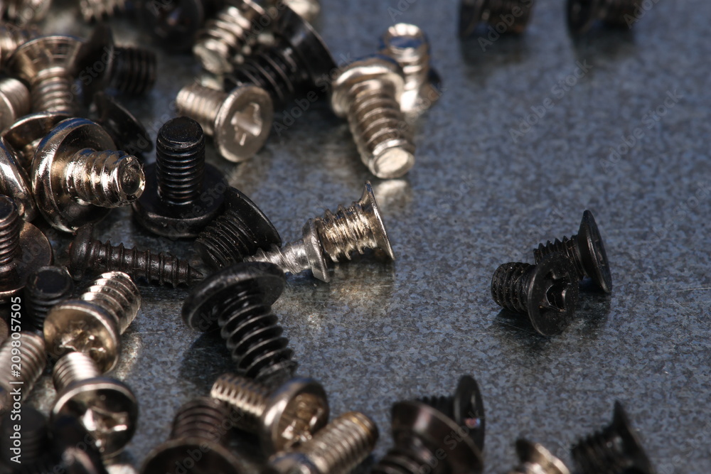 Fototapeta premium Metal screws for fastening equipment. Soft focus. Close-up. 