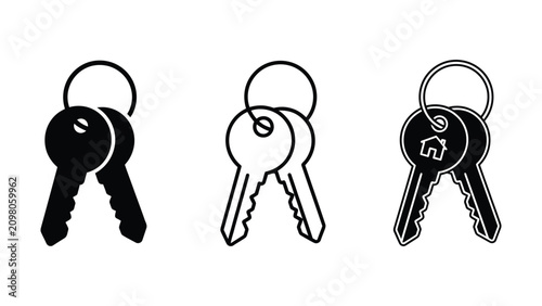 Three black and white house keys on a ring  isolated on white