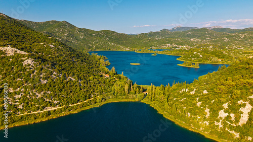 Obraz na plátně Aerial view of Bacina Lakes in Dalmatia, Croatia, featuring blue water, green hi