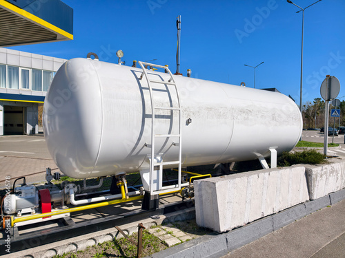 Liquefied gas storage tank at a modern gas station during daytime