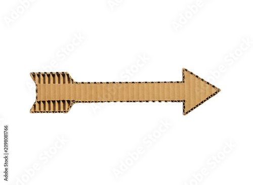 Brown cardboard arrow pointing right