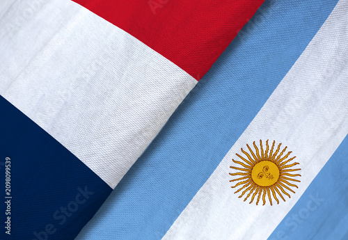 Close-up of France and Argentina flags side by side, symbolizing international relations, diplomacy, or sports rivalry.