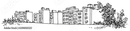 Foto Apartment buildings and residential blocks situated behind wild meadow plants ha