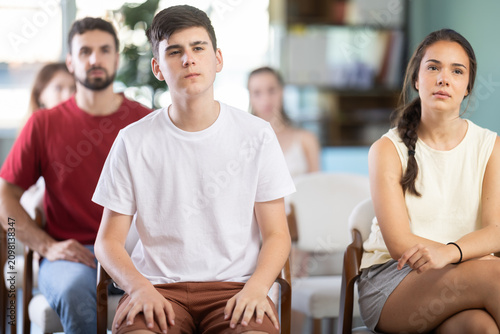 Fotografie Students or class visitors attend studying, listens to teacher