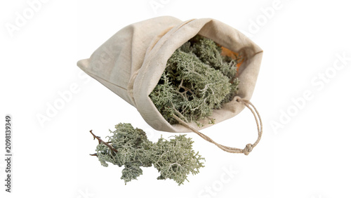 Photos Small textile bag full of organic dry medicinal herbs alternative health isolate