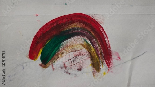 Fotografie Vibrant rainbow arc painted with acrylics on white textured paper surface
