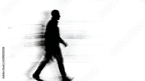Motion Blur Silhouette of a Man Walking on White Background