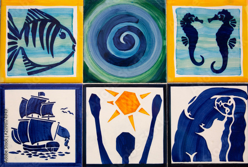 Colorful, nautical-themed tiles on a wall in Ferragudo, Portugal
