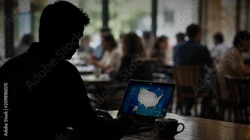 Man working on his laptop in coffee shop