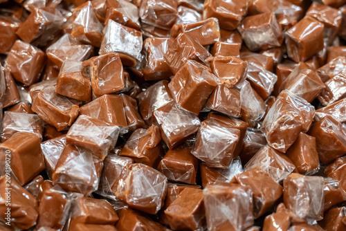 Caramel square candies for sale in a bulk candy store. Fort Worth, Texas, USA. 