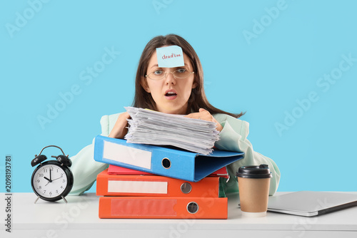 Overwhelmed young woman wit...