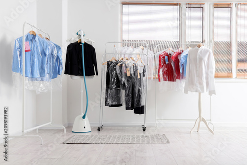 Clean clothes on racks in a...