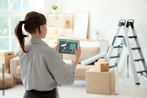 Woman using a smart home se...