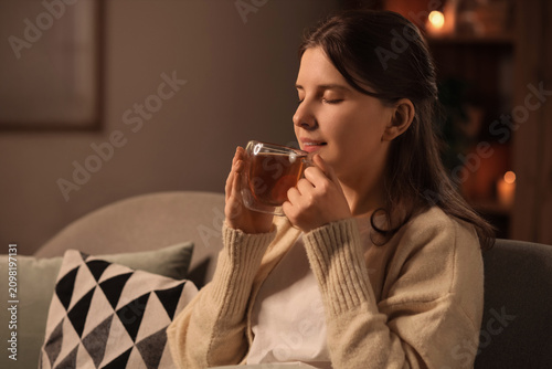 Young woman enjoying a warm...
