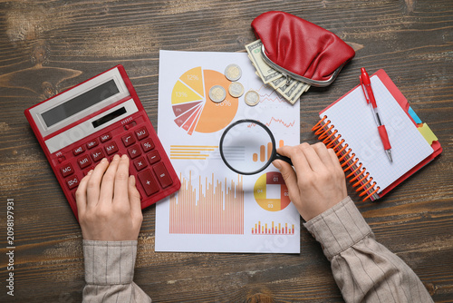 Person analyzing financial ...