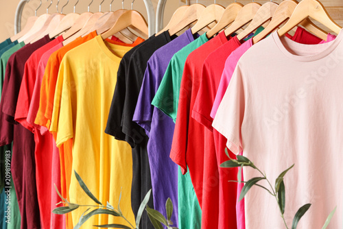 Colorful t-shirts on wooden...