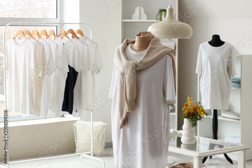 Foto Mannequin with white t-shirt and sweater in dressing room