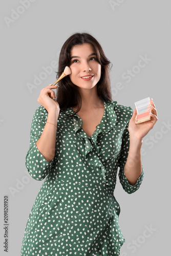 Beautiful young woman apply...