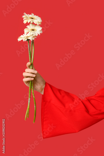 Female hand holding beautif...