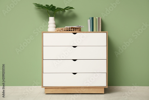 Chest of drawers with books...
