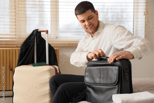 Young businessman with brie...