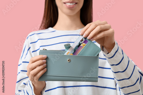 Woman with credit card hold...