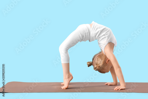Cute little girl with mat p...
