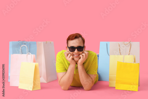 Young man with shopping bag...