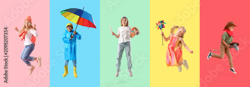 Five diverse children jumping with various props childhood joy creativity and imagination on colorful backgrounds  a girl in a beanie jumps on pink a boy in a raincoat holds a rainbow umbrella