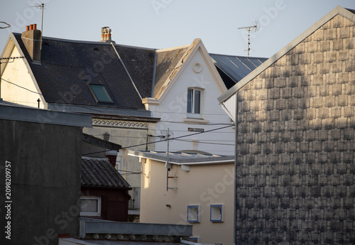 Traditional european rooftops with slate shingles and television antennas