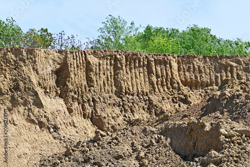 Pit of clay soil with traces of excavator work