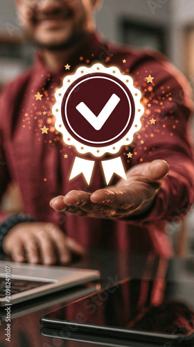 Quality Assurance and Excellence: A person holds out their hand, showcasing a digital badge symbolizing quality assurance and excellence. The badge, adorned with a checkmark and ribbon.