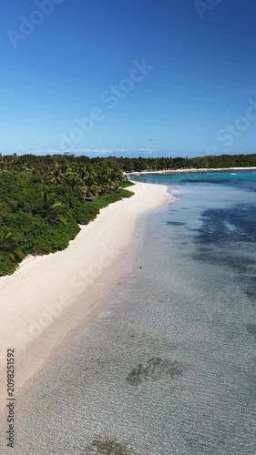 Vertical aerial view of a tropical island beach, Oarsmans Bay, Fiji