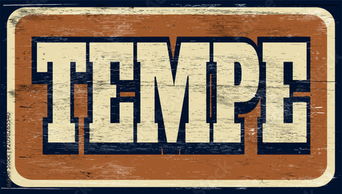 Age and worn vintage Tempe sign on wood